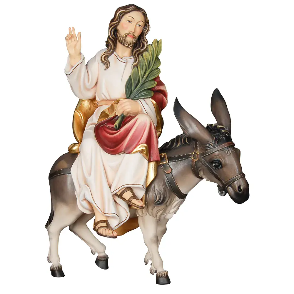 Jesús sentado con burro