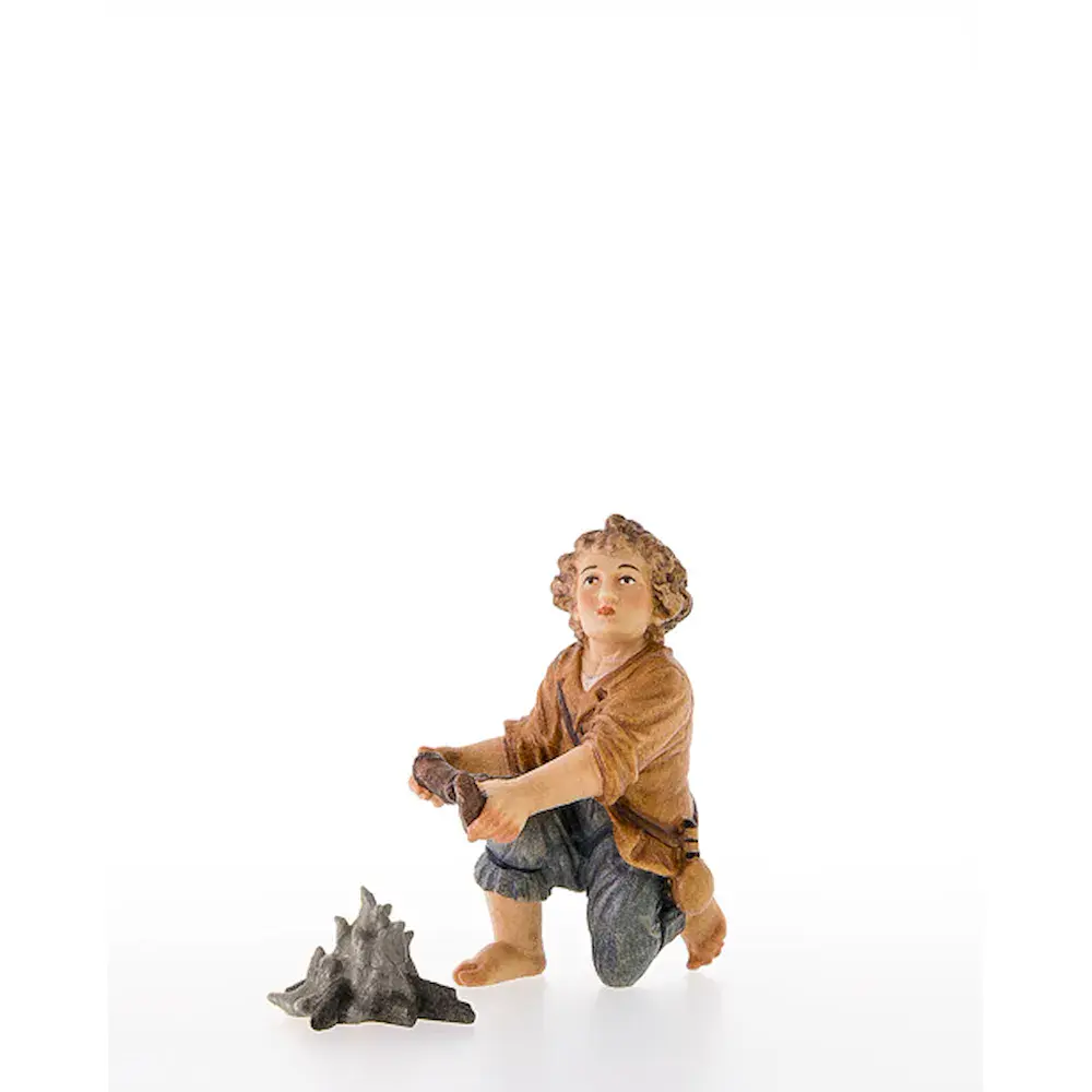 Child kneeling without fireplace
